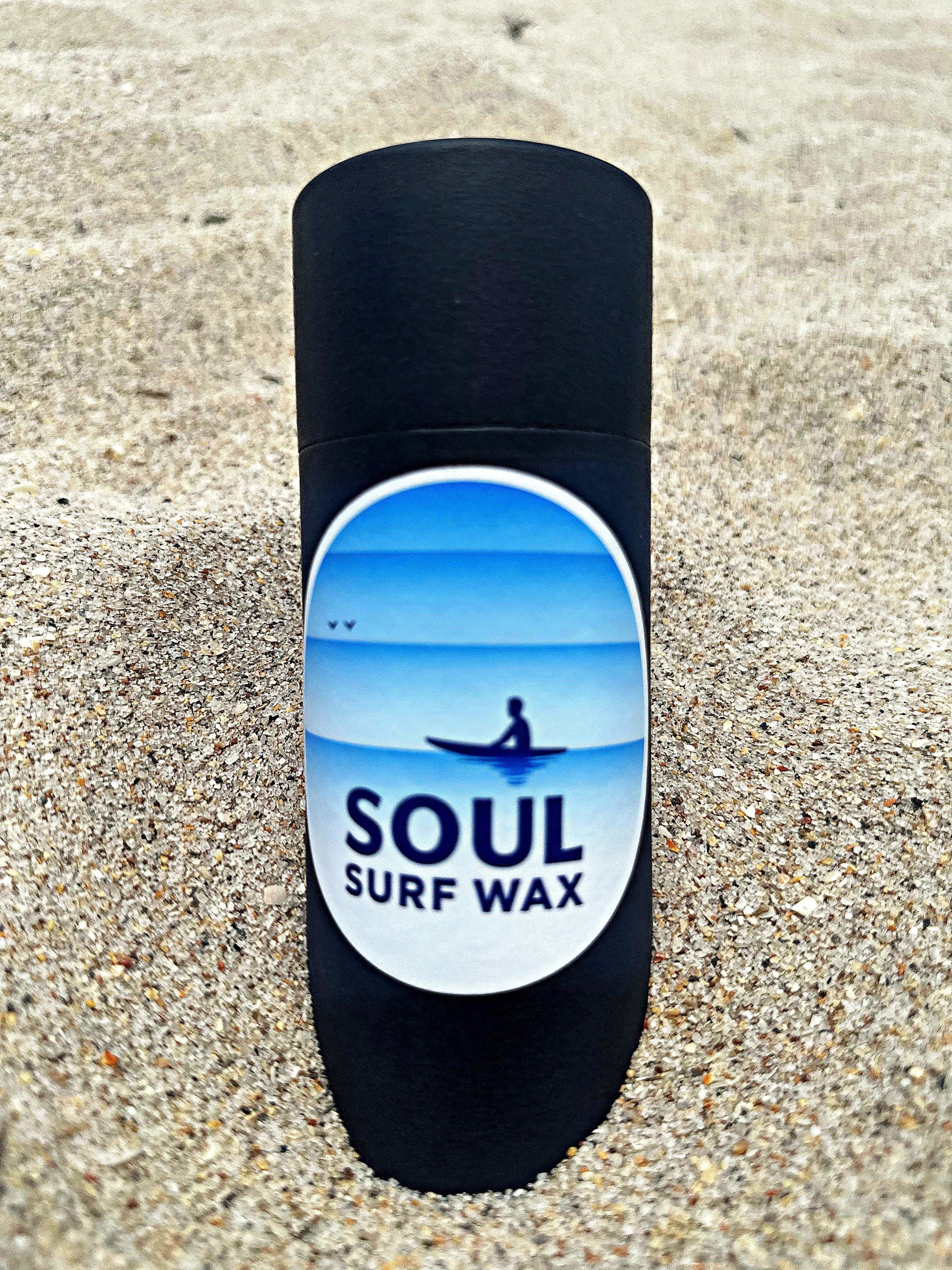 Soul Surf Wax tube standing in the sand